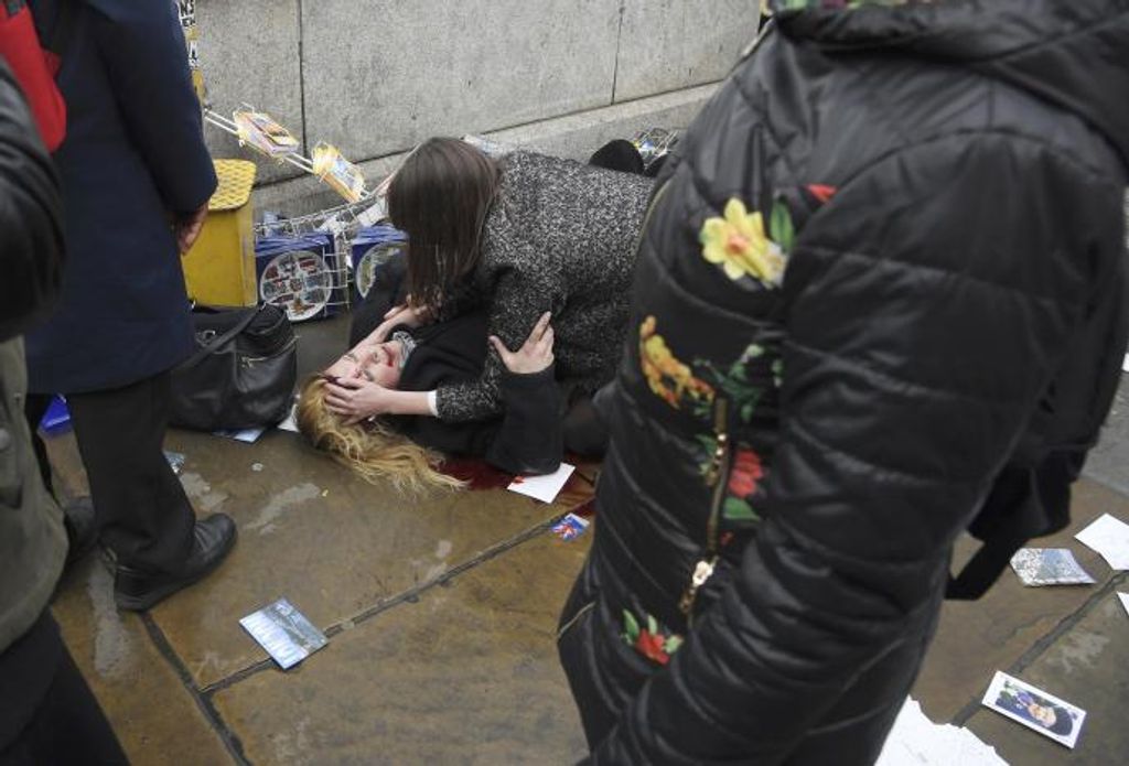 A woman lies injured after an incident on Westminster Bridge in London