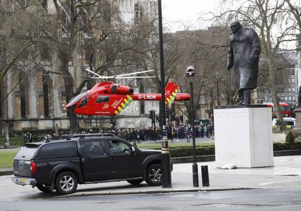 An air ambulance lands in Parliament Square during an incident on Westminster Bridge in London