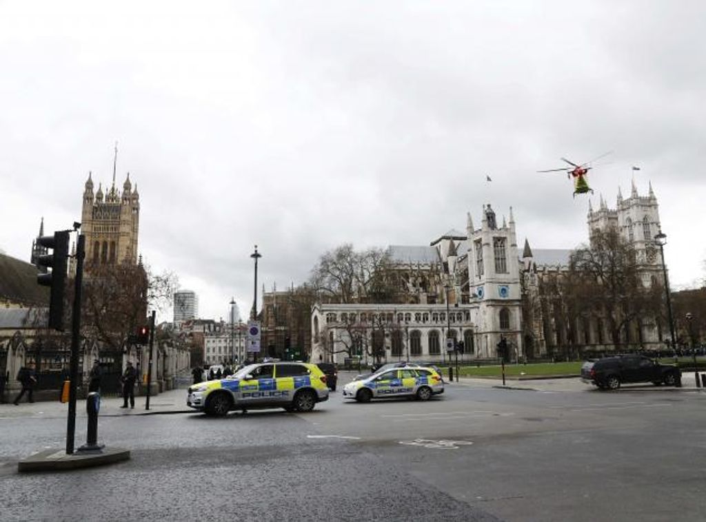 An air ambulance lands in Parliament Square during an incident on Westminster Bridge in London