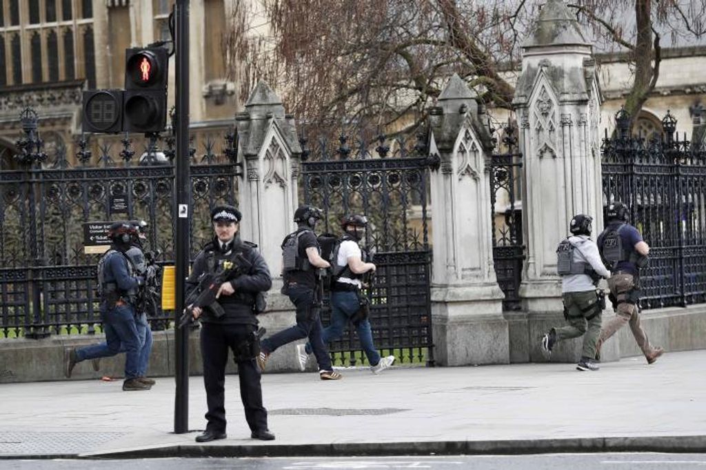 Armed police respond outside Parliament during an incident on Westminster Bridge in London