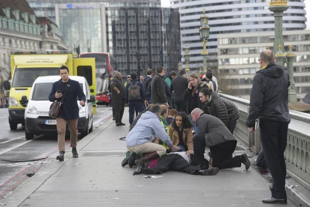 Injured people are assisted after an incident on Westminster Bridge in London