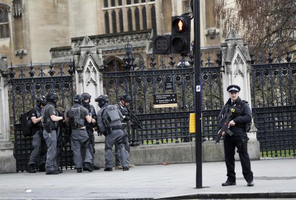 Armed police respond outside Parliament during an incident on Westminster Bridge in London
