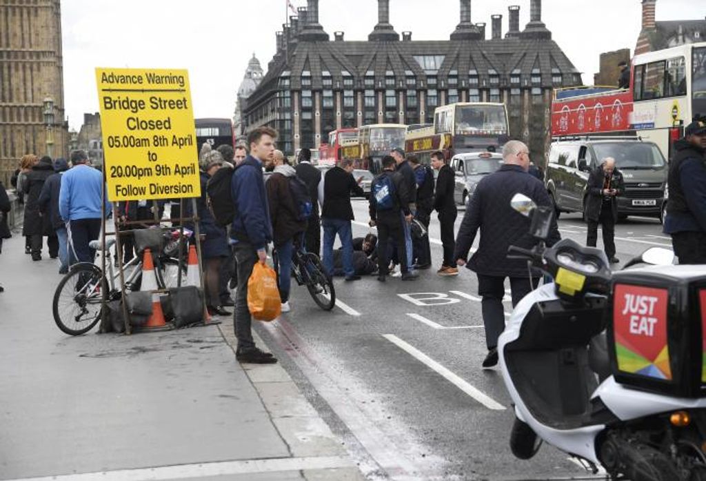 Injured people are assisted after an incident on Westminster Bridge in London