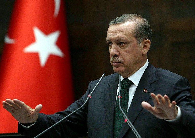 Turkey's Prime Minister Recep Tayyip Erdogan addresses members of parliament from his ruling AK Party (AKP) during a meeting at the Turkish parliament in Ankara on June 11, 2013. Embattled Turkish Prime Minister Recep Tayyip Erdogan has chosen to portray himself as a martyr battling dark forces as he faces unprecedented protests against his government. Erdogan, who is facing by far his greatest challenge since his Islamist-rooted AKP party came to power a decade ago, said the protesters were being manipulated either by the Turkish opposition or mysterious powers such as the
